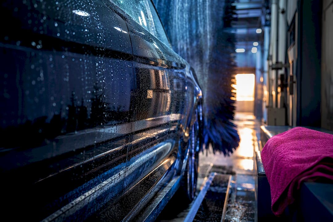 Anonymous car panel inside automatic wash